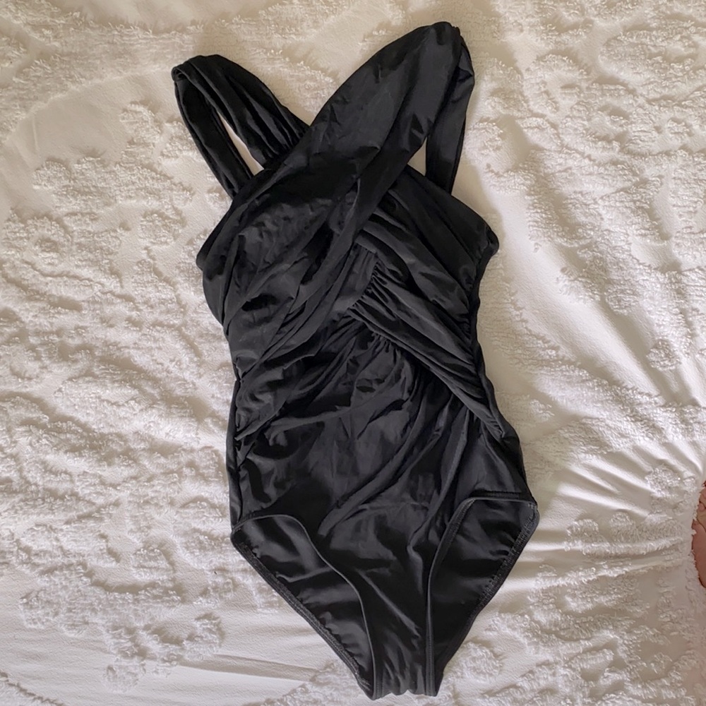 One piece black swim suit by miracle suit